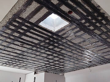 Carbon Fiber Plate Strengthening of RC Slabs with Openings